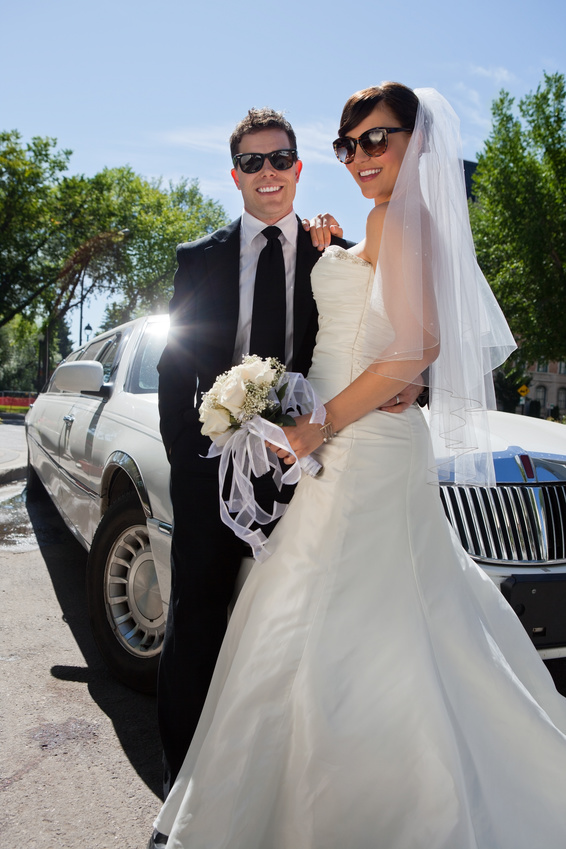 Cool couple in front of limousine